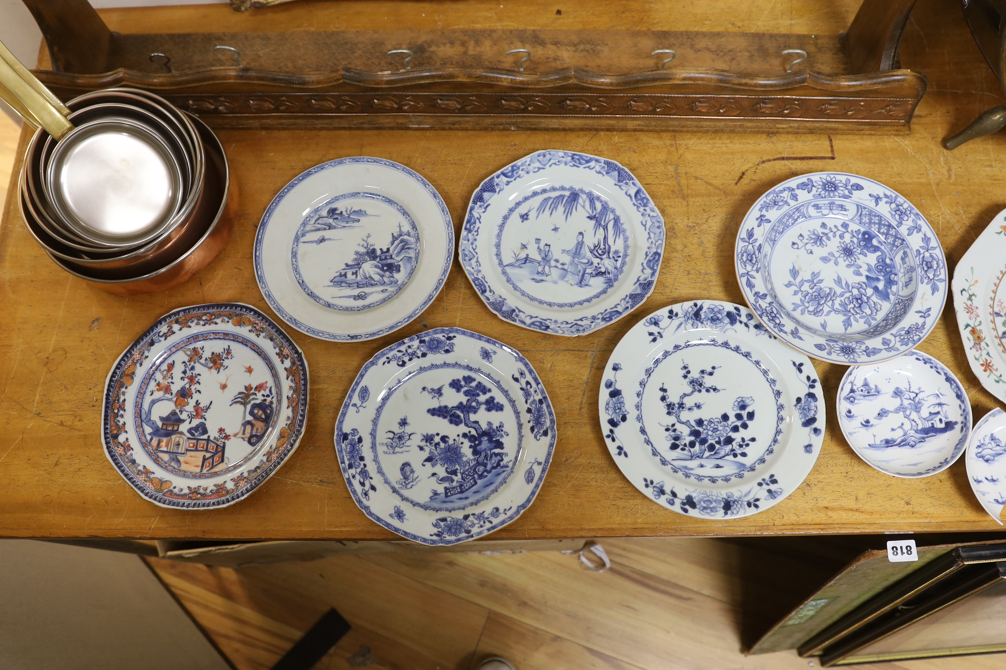 A group of 18th century Chinese porcelain plates and saucers, mostly blue and white and an octagonal famille rose example, together with three Japanese dishes, largest 27cm in diameter